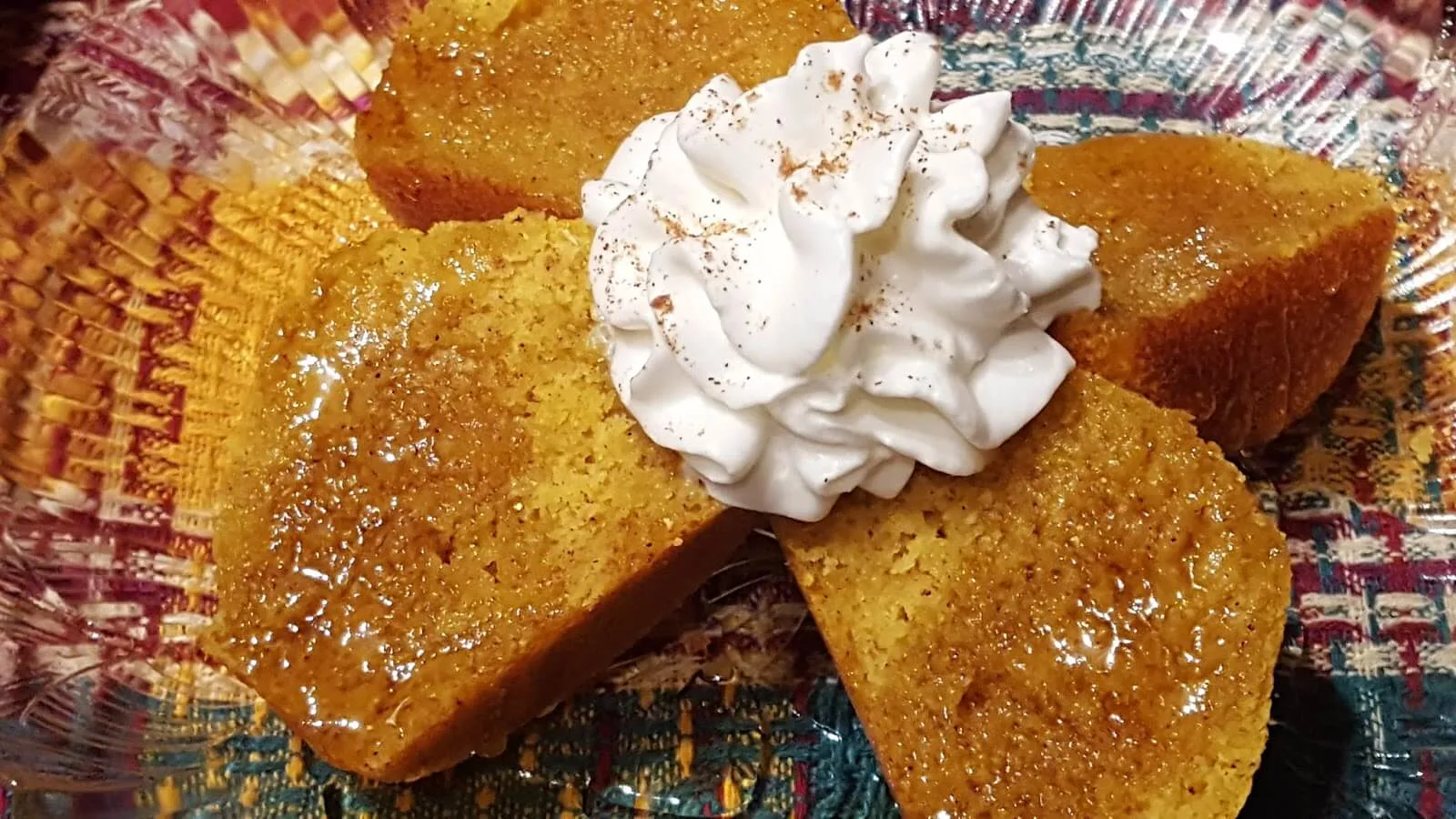 Pumpkin Cornbread Muffin with honey and whipped cream and cinnamon 