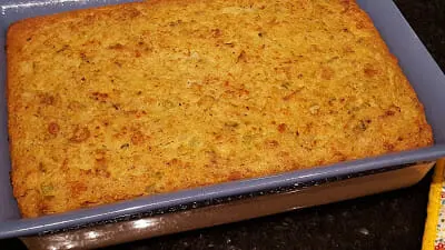 Awesome Best Southern Cornbread Dressing in a blue casserole dish