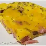 wedge slice of frittata with ham and mushrooms