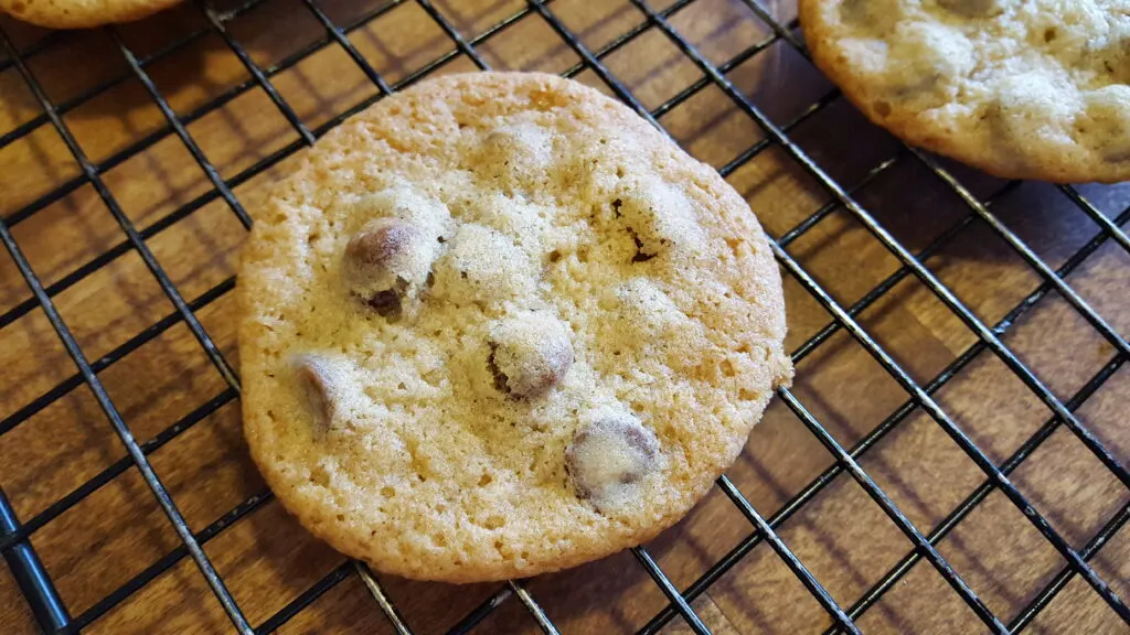 chocolate chip cookie cooling on a rack