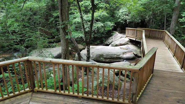 Wooden deck walking path to trail in Table Rock state park in Pickens country South Carolina - hiking