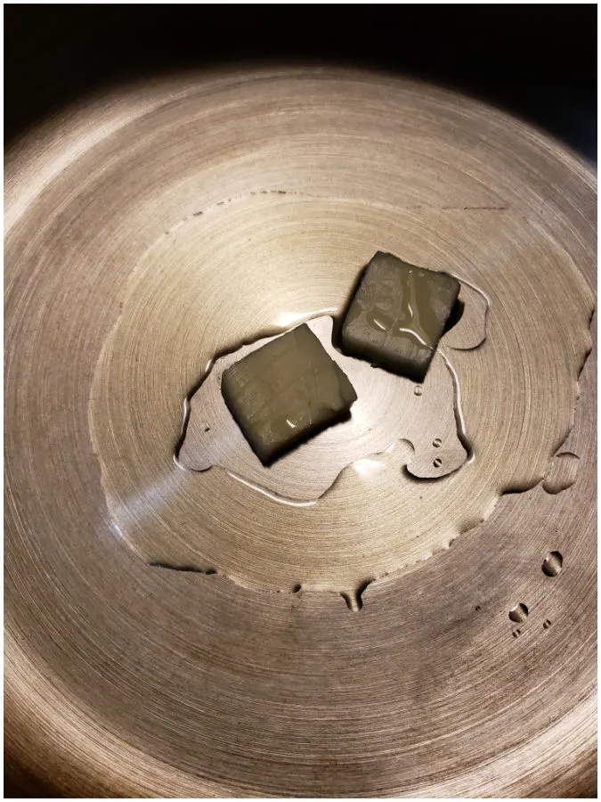 Adding oil and butter to a large stainless skillet