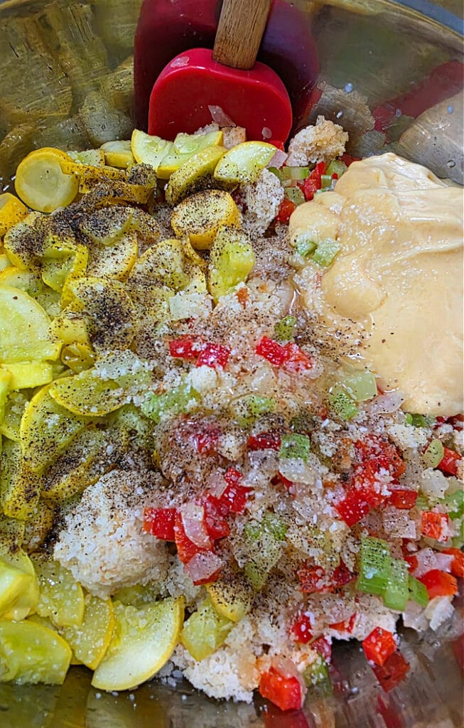 Mixing bowl with squash dressing ingredients to combine