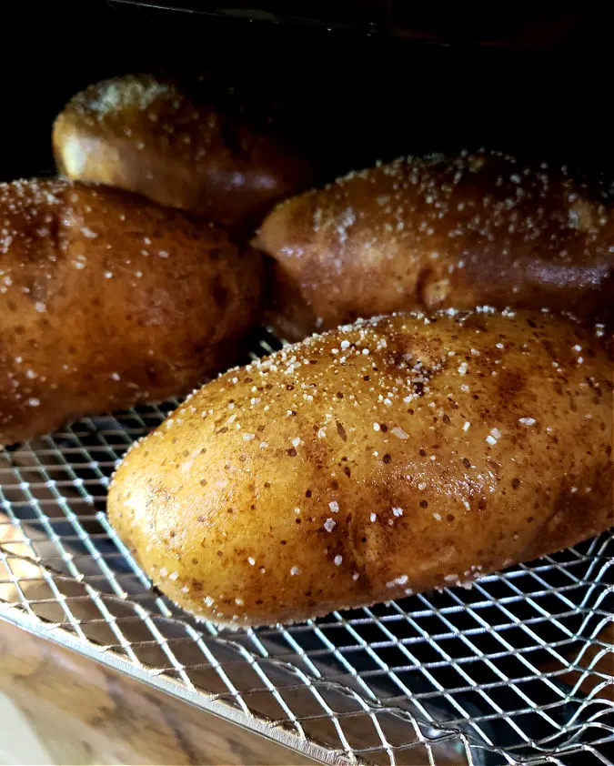 Salt skins of potatoes place into air fryer. Best Air Fryer Baked Potato Recipe