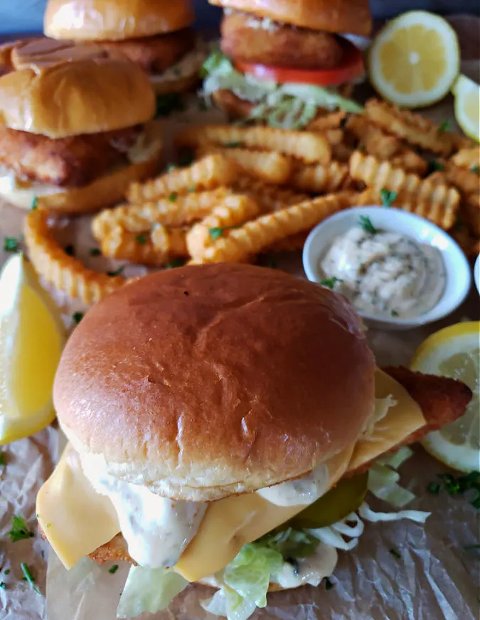 Copycat restaurant air fryer fish sandwiches with topping and oven baked french fries