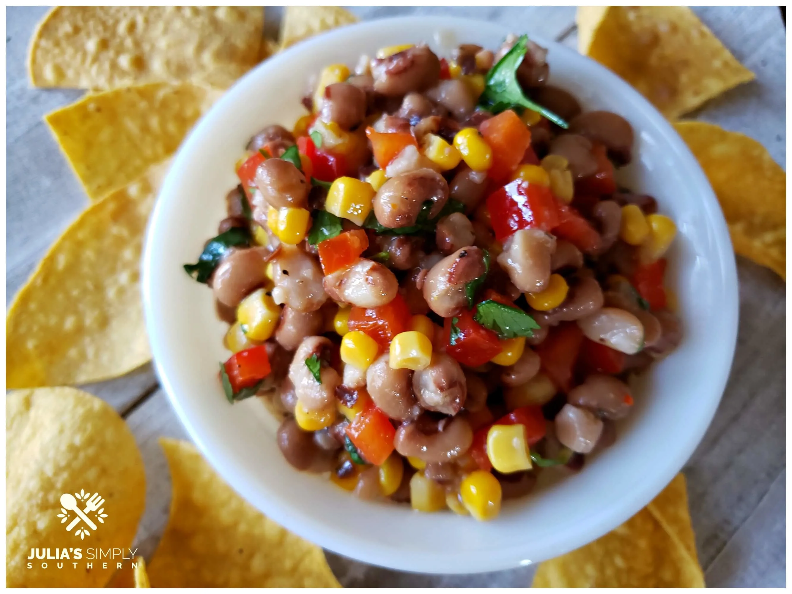 bowl with an easy dip recipe served with chips for dipping
