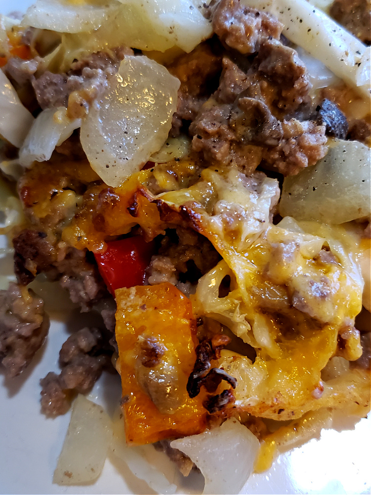 Cheesy ground beef and cabbage recipe serving on a dinner plate