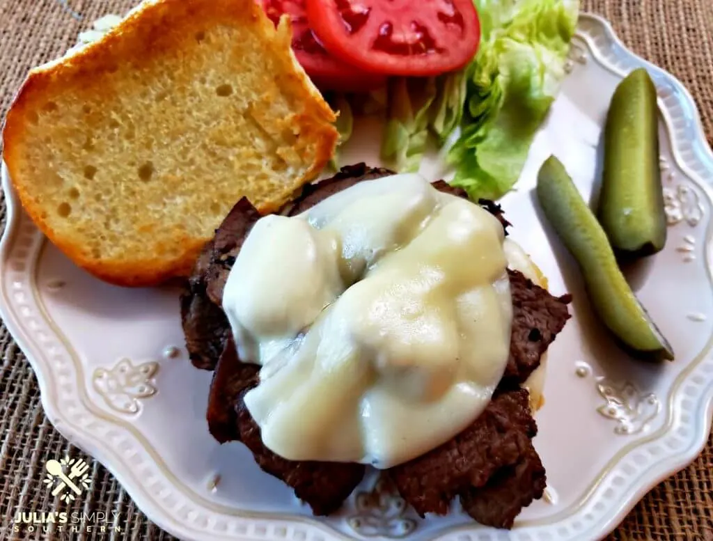 Toasted bun with tender beef, melted provolone, lettuce and tomato