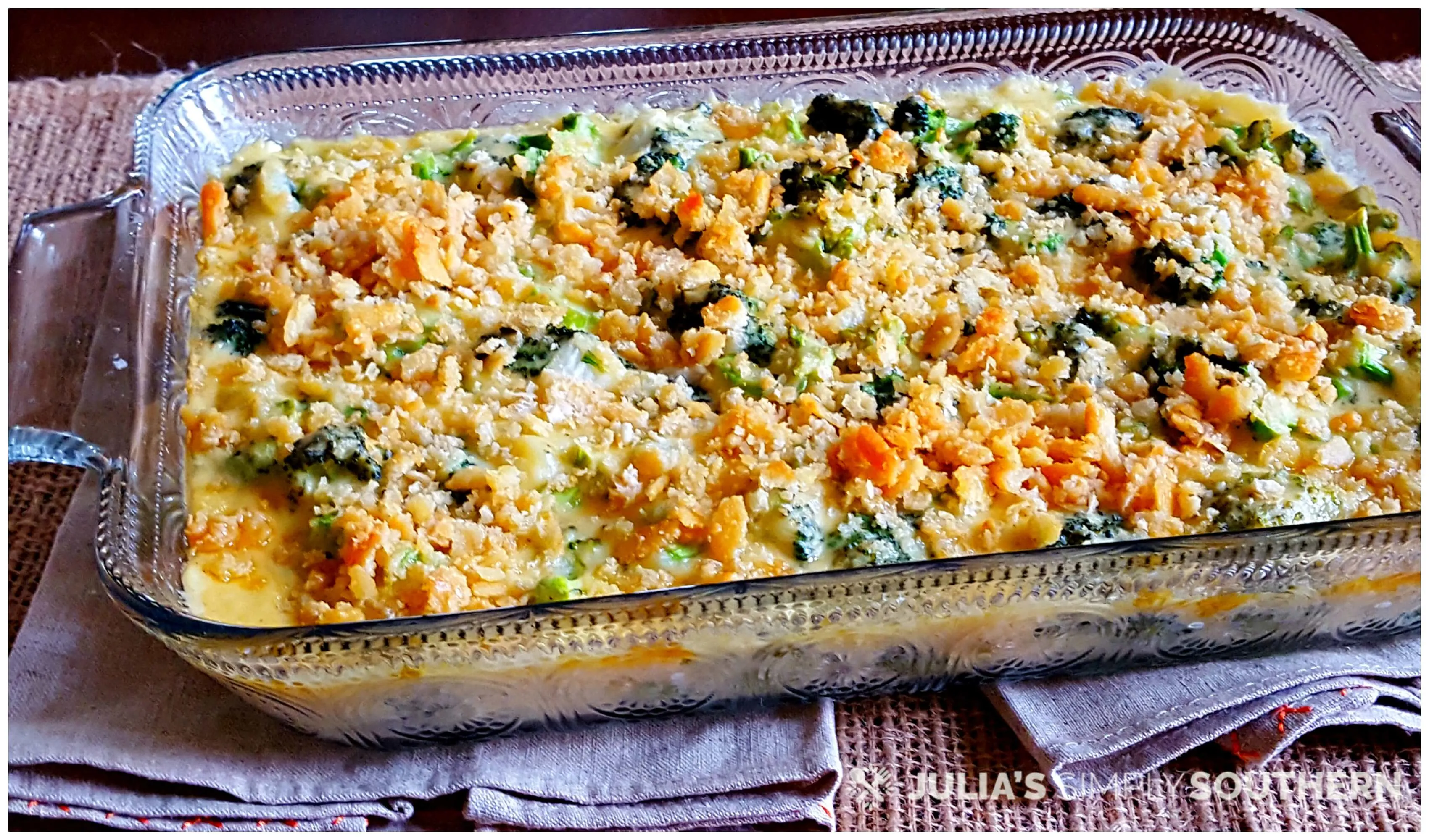 Glass casserole dish with baked broccoli and cheese topped with Ritz