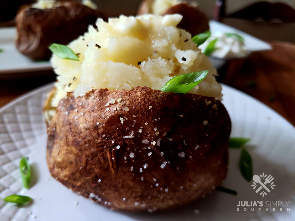 Air Fryer Baked Potato with butter and sour cream.
Best Air Fryer Baked Potato Recipe
