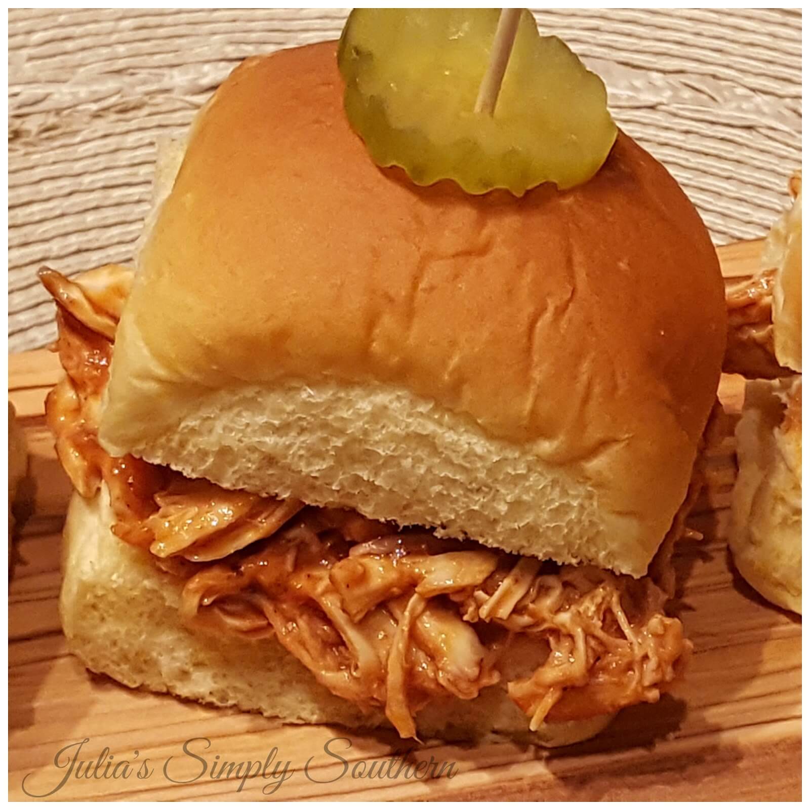 Barbecue Chicken Slider Sandwiches with a pickle served as appetizers or a meal