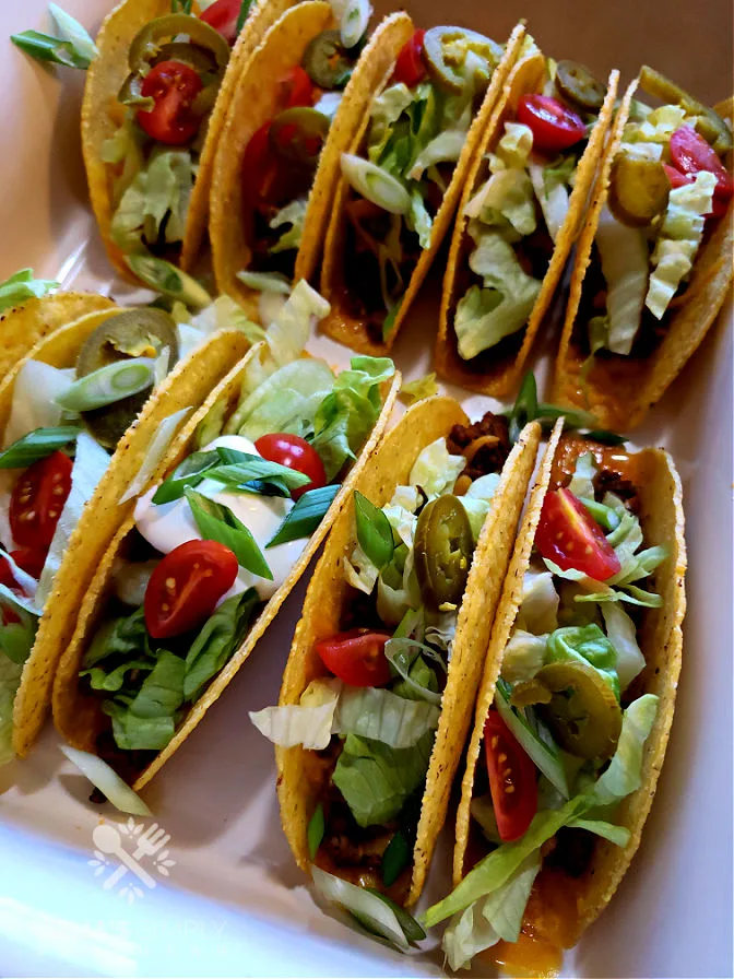 Baked Hard Shell Tacos - family favorite meals for Taco Tuesday - tacos with toppings in this easy cheesy oven baked tacos recipe