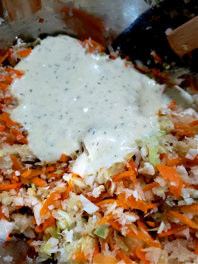 combining mayonnaise dressing with slaw mix