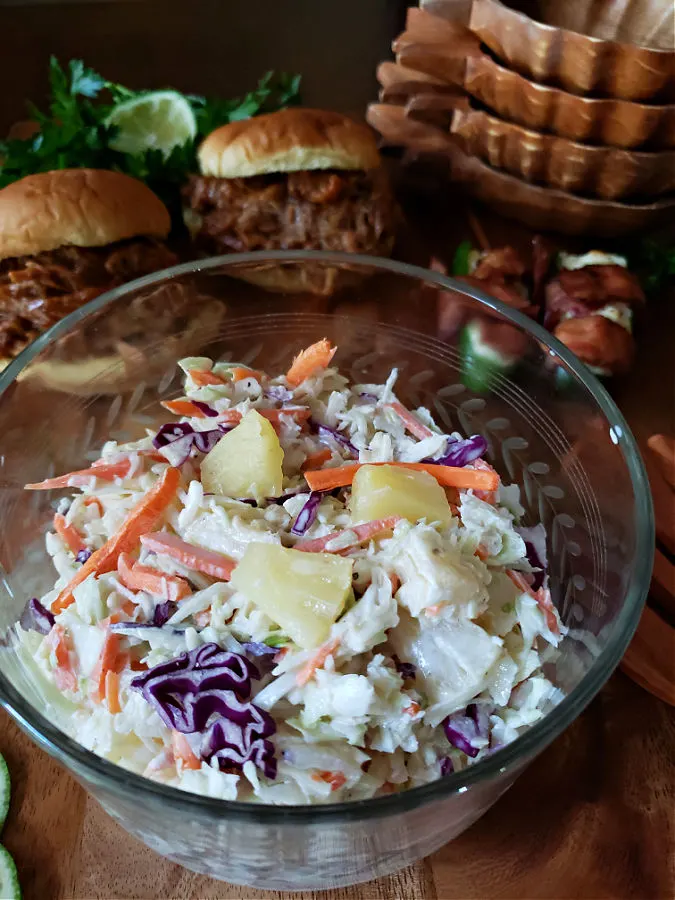 Pineapple Coleslaw summer side dish in a crystal serving bowl