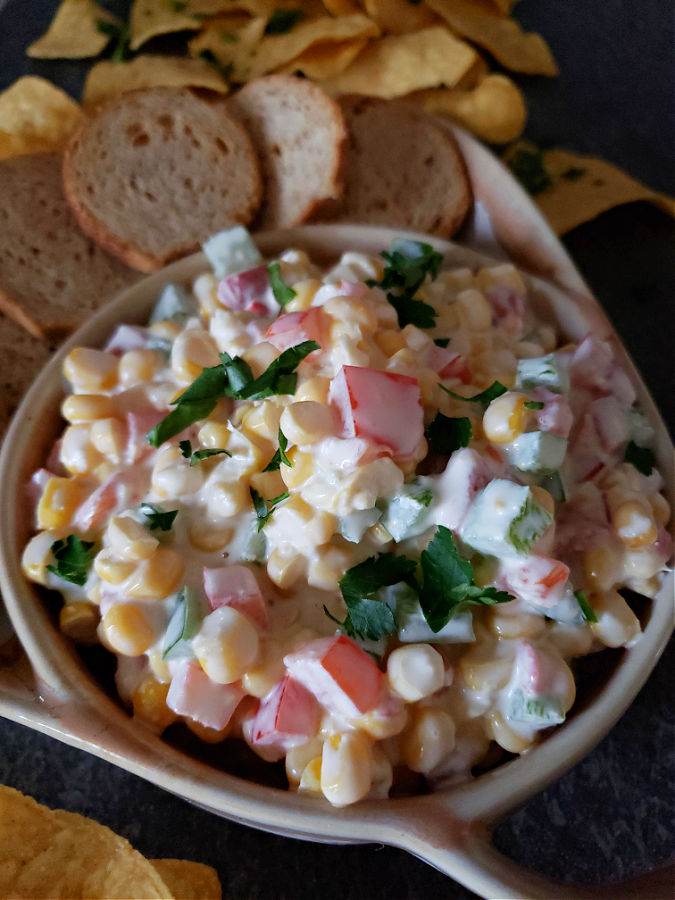 cold appetizer dip made with sweet corn served with chips