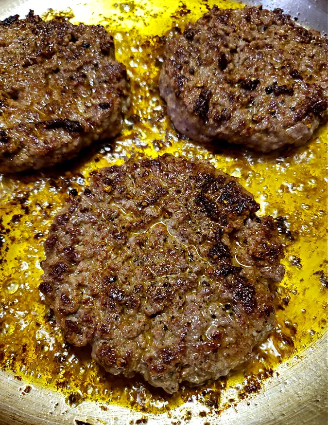 Frying hamburger steaks on the stove top