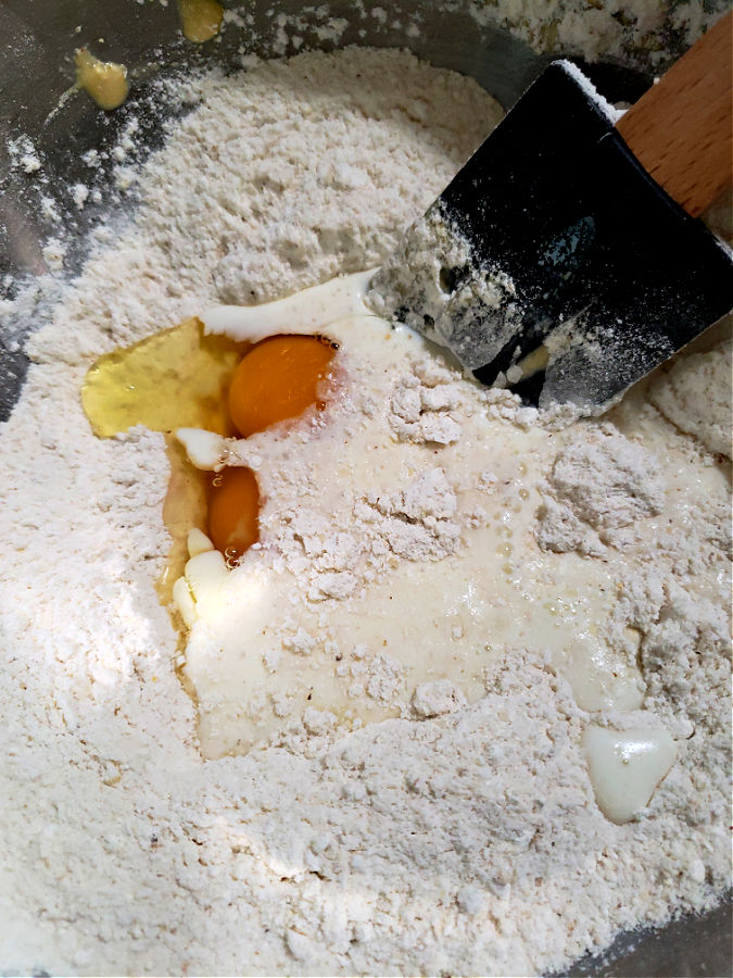 adding wet ingredients to cornbread mixture