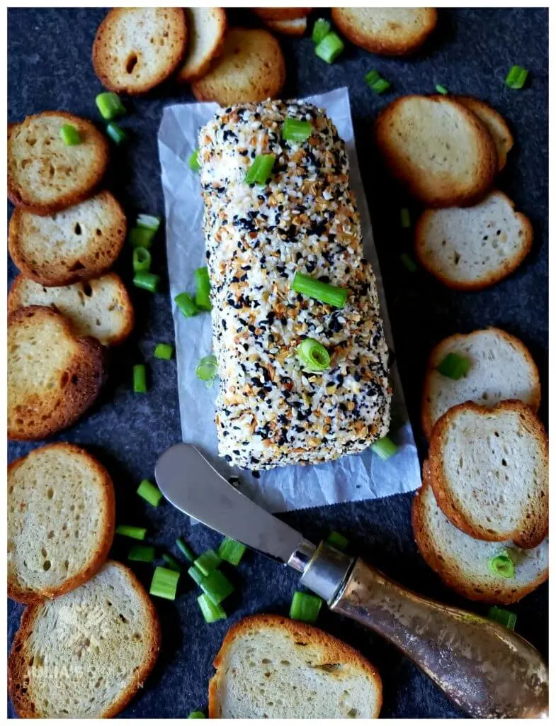 Cheese log appetizer coated in everything but the bagel seasoning