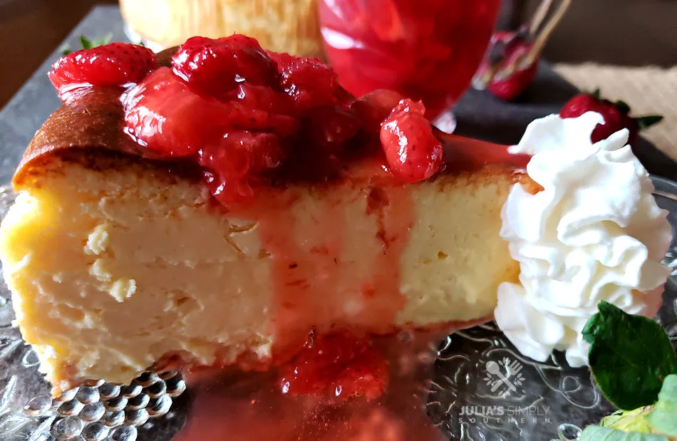 Homemade Martha Steward Cheesecake Recipe with Fresh strawberry topping and whipped cream like cheesecake factory on a serving plate