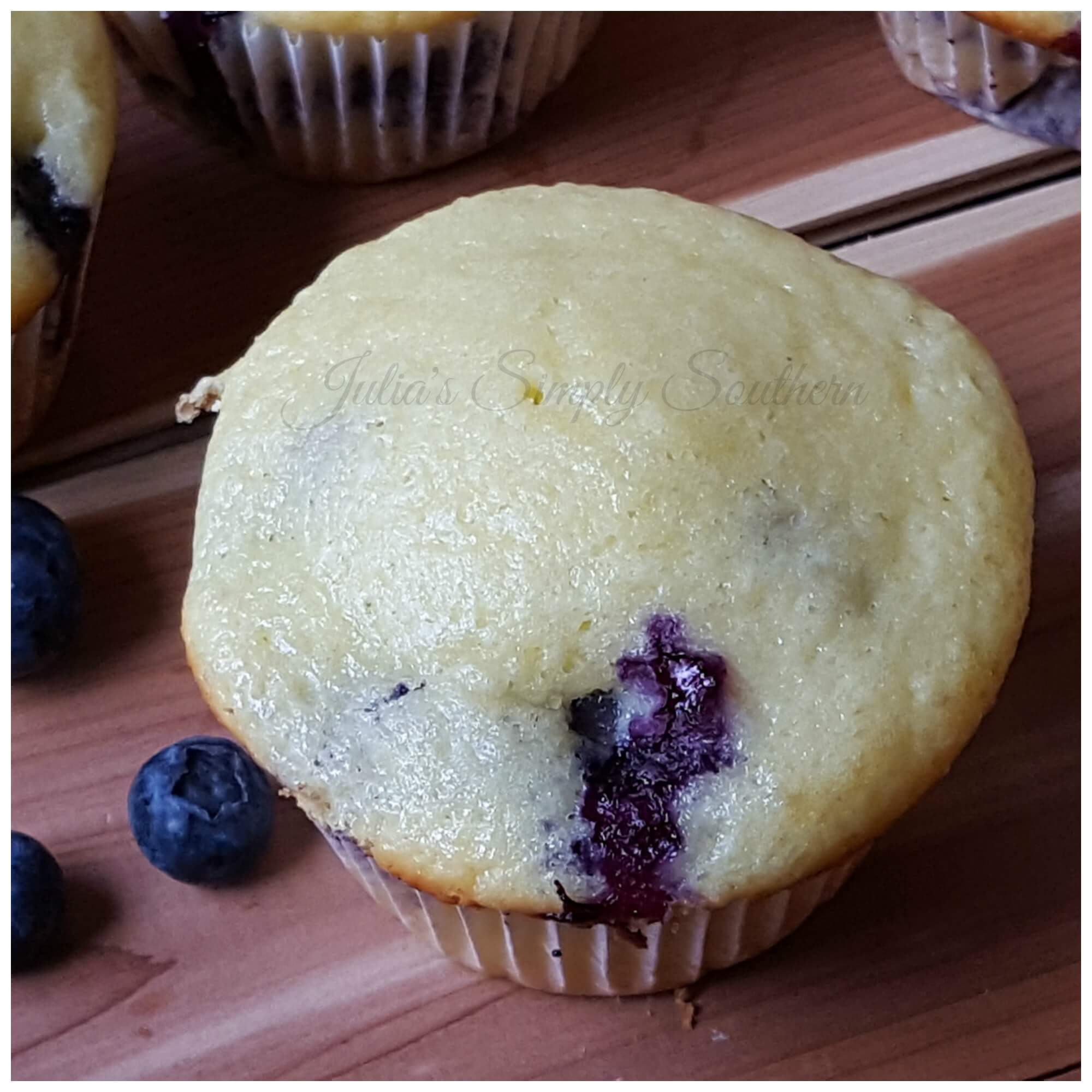 Buttermilk Blueberry Muffins on a wooden table