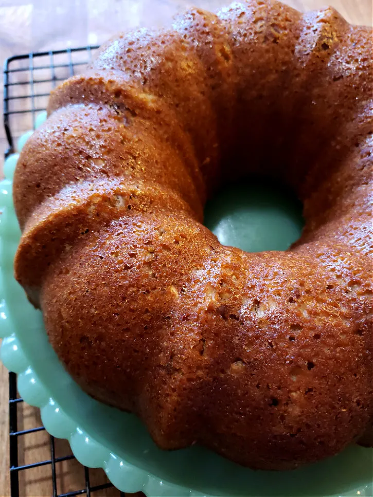 Best recipe butter pecan cake cooling on a green milk glass platter