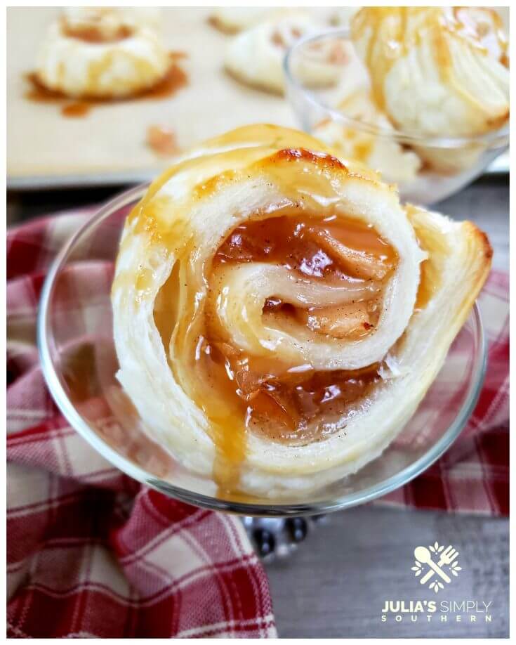 Easy and elegant apple pie puff pastry pinwheel dessert, served with vanilla ice cream and drizzled with caramel sauce. A delicious fall dessert recipe.