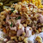 Canned Turkey Stuffing Casserole Thanksgiving Dinner Recipe on a plate with string beans and corn