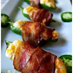 The easiest and best jalapeno poppers recipe. These bacon wrapped appetizers will disappear fast.