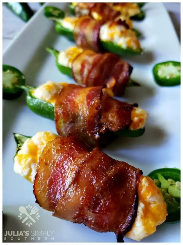 The easiest and best jalapeno poppers recipe. These bacon wrapped appetizers will disappear fast.