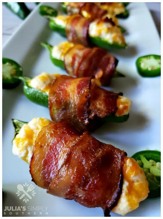 The easiest and best jalapeno poppers recipe. These bacon wrapped appetizers will disappear fast.