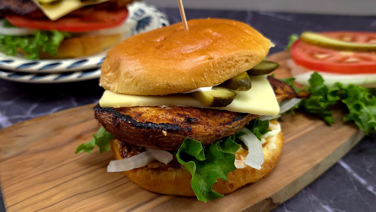 Easy Blackened Chicken Sandwich Recipe – Juicy & Flavor-Packed with a marinated chicken breast on a toasted brioche bun with melty cheese and favorite toppings.