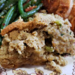 Easy Crock Pot cornbread dressing recipe on a Thanksgiving plate with roasted turkey and green beans
