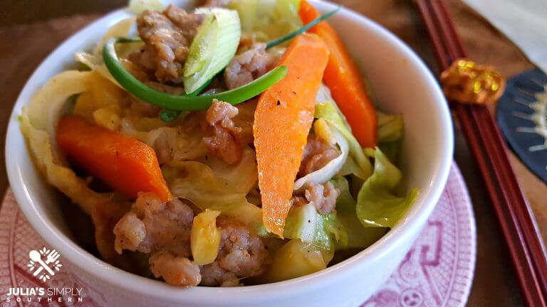 Low Carb Pork, Cabbage and Carrot Stir Fry on red and white china