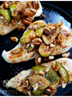 Amazing boneless chicken breast recipe topped with a honeyed fig and pecan topping, cooked in a cast iron skillet in under 15 minutes