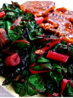Amazing Swiss Chard Recipe - easy and healthy vegetable side dish, pictured on a platter with pork chops