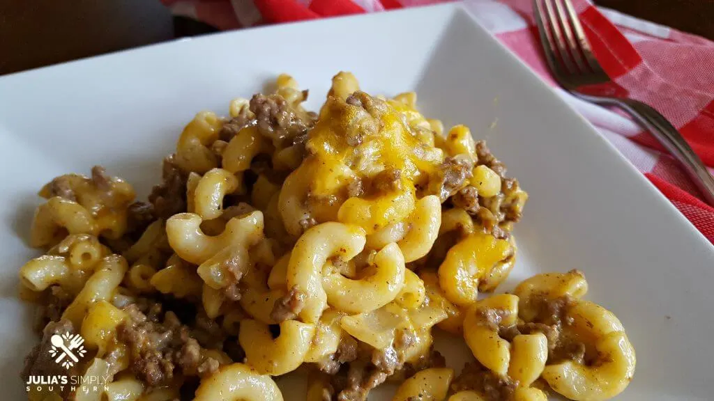 Ground Beef Casserole on a white plate with red and white napkins