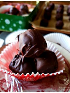 Old Fashioned Peanut Butter Balls in a holiday paper cup