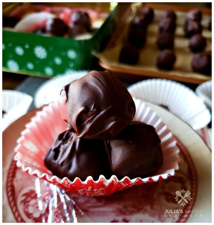 Old Fashioned Peanut Butter Balls in a holiday paper cup