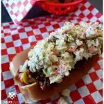 Best southern style hot dogs recipe topped with creamy coleslaw