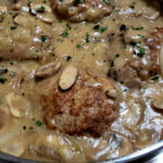 Southern Style Turkey Salisbury Steak with Gravy Recipe in a large stainless skillet