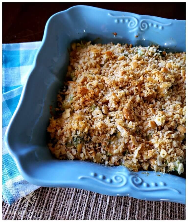 Classic Broccoli Casserole Recipe with Ritz Crackers in a square teal casserole dish