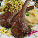 Easy lamb chops recipe with flavorful marinade. Baby lamb chops on a bed of mashed potatoes.