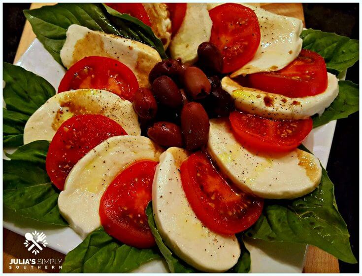 simple caprese salad with tomatoes mozzarella basil