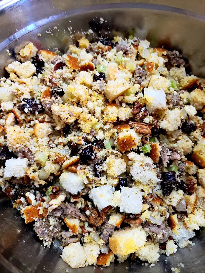 mixing bowl with cornbread dressing mixture before adding to a baking dish