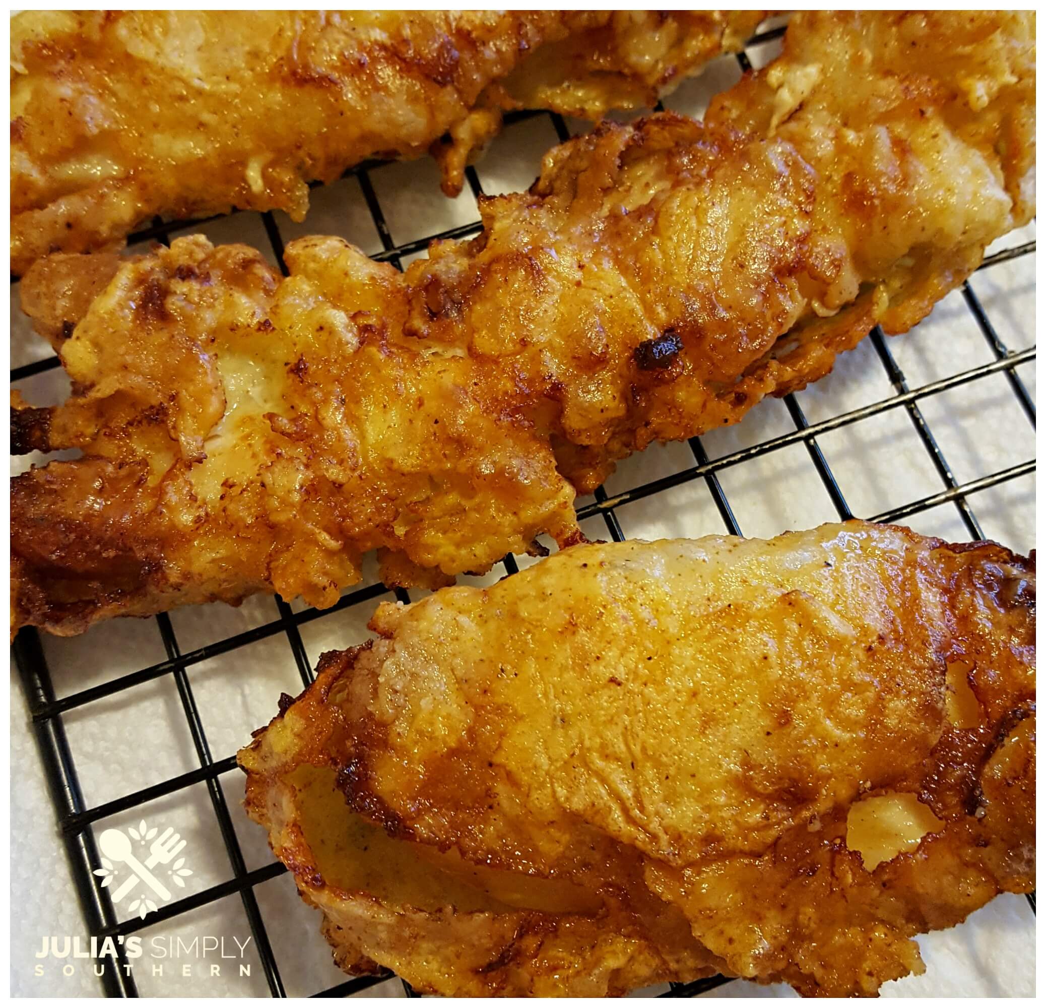 Remove excess oil from fried chicken tenders