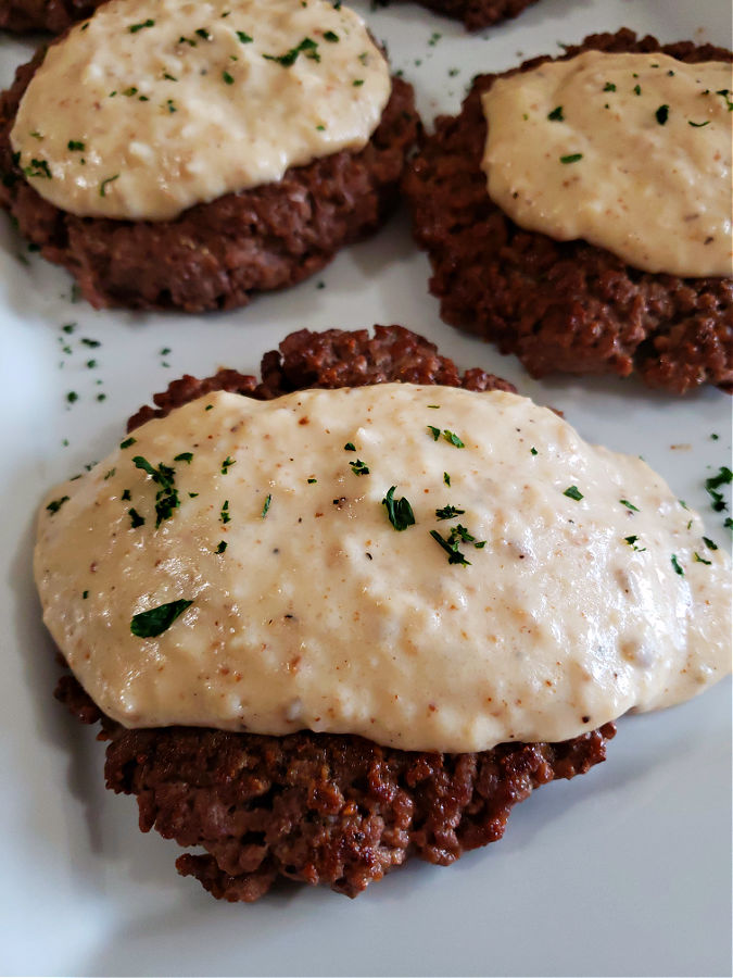 Classic Hamburger Steak patty topped with creamed gravy
