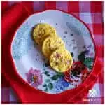 Easy Ham and Cheese Egg Muffins on a floral plate sitting on red and white linens