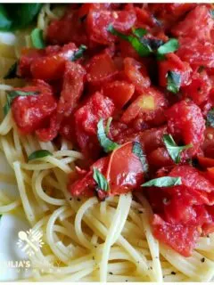 Fresh summer tomatoes with basil and pasta. This easy recipe cooks up quick for busy family dinners.