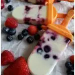 Summer ice cream treats made with frozen vanilla yogurt and fruit in silicone molds