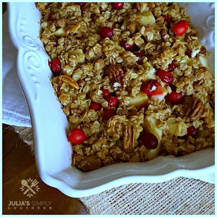 Cran apple bake for the holidays in a white scalloped baking dish - crisp